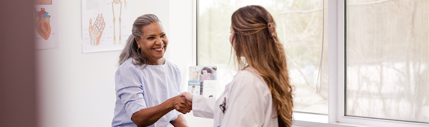 doctor laughing with her patient